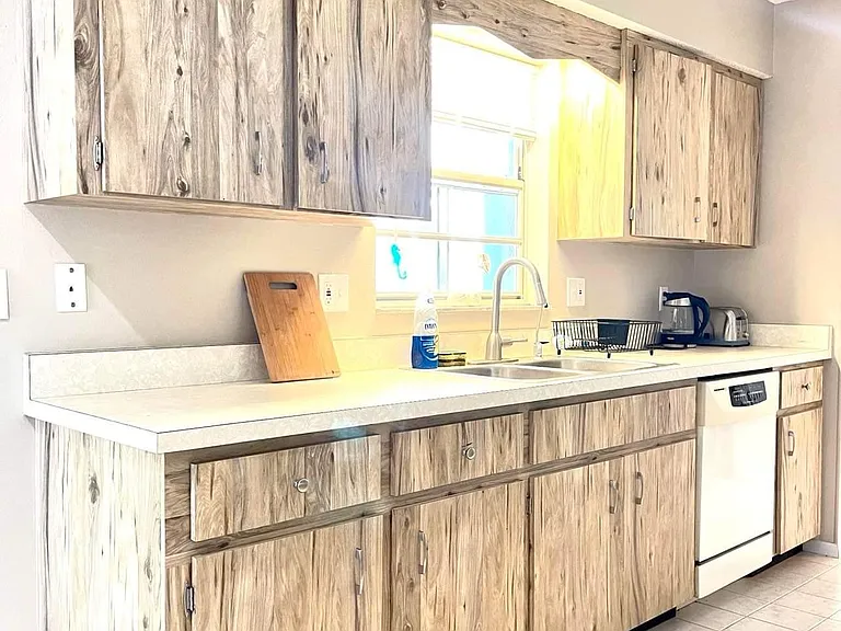 Kitchen sink, countertops, and dishwasher
