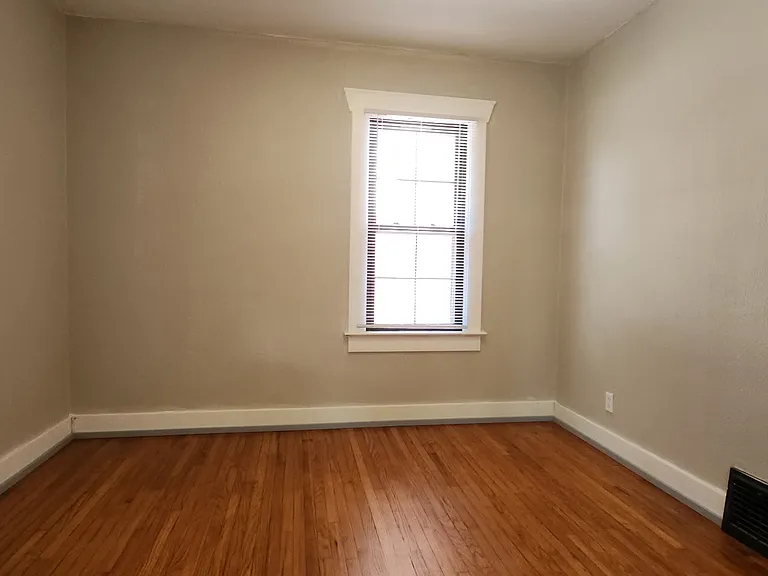 Partial view of the front bedroom, located off of the living room.