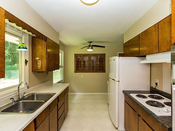 View of Kitchen into Dining Area (note built in hutch)