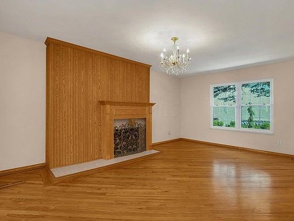 Ah, the Living Room (24x11') with decorative fireplace