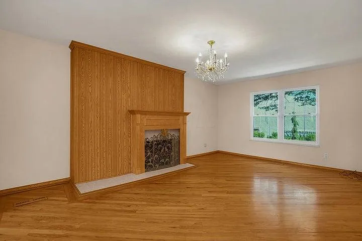 Ah, the Living Room (24x11') with decorative fireplace