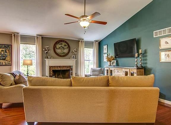 Woodburning Fireplace, wood flooring and tasteful decor.....