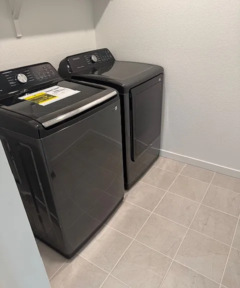 Brand new washing machines in large laundry room
