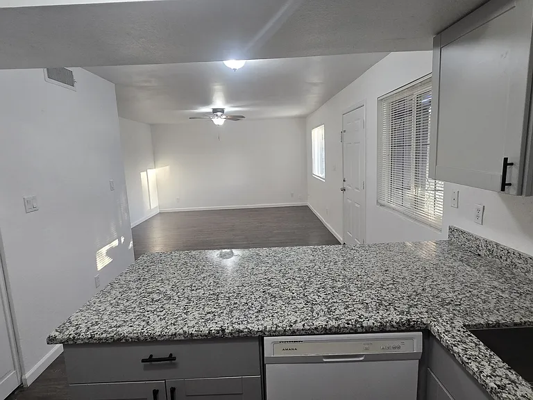 Open concept kitchen, dining and living room.