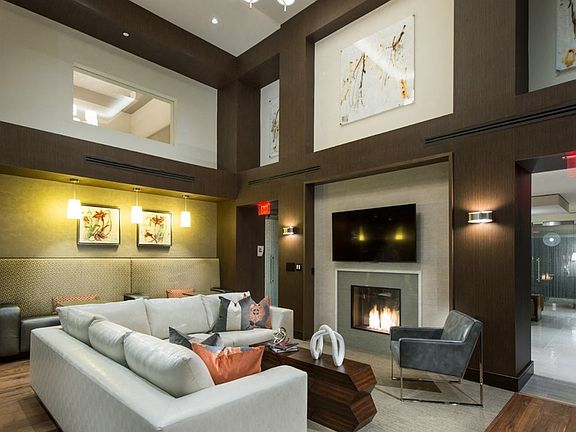 Comfortable lounge with fireplace and TV