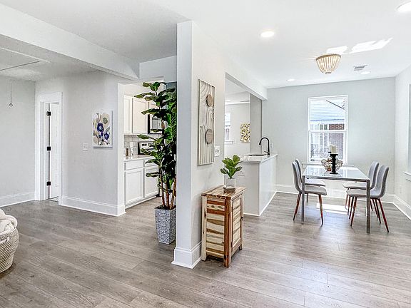 Kitchen is on Left and Dining area is on right. (Photographer is in the Living Room)