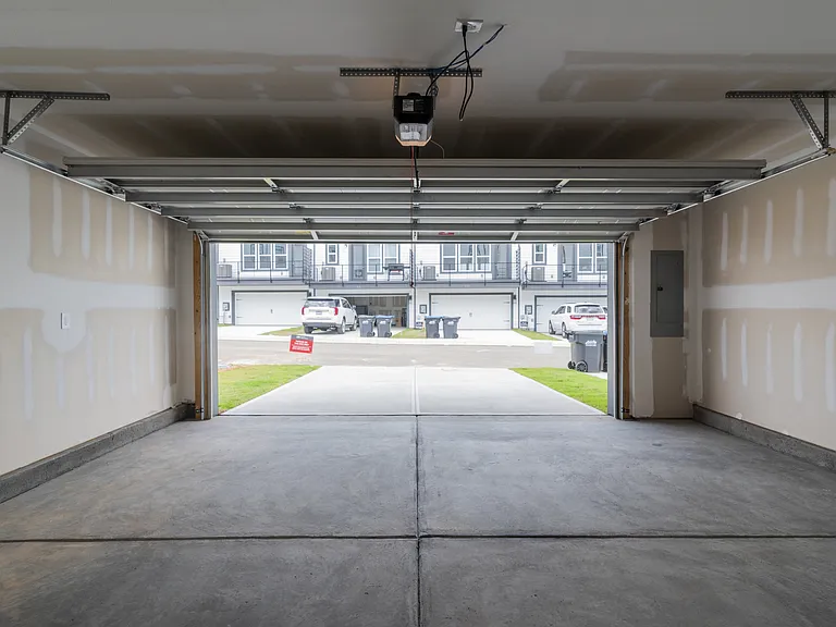 Two car garage with driveway parking