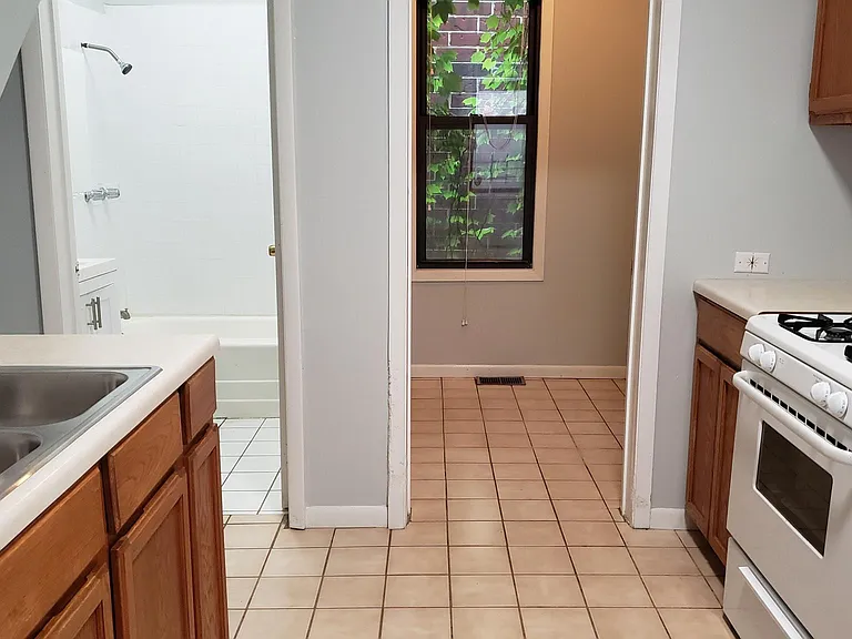 small room off kitchen can fit table or can be storage/pantry