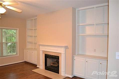 Brand new paint and flooring in entire house.  Large living room with gas fireplace and built in cabinetry.