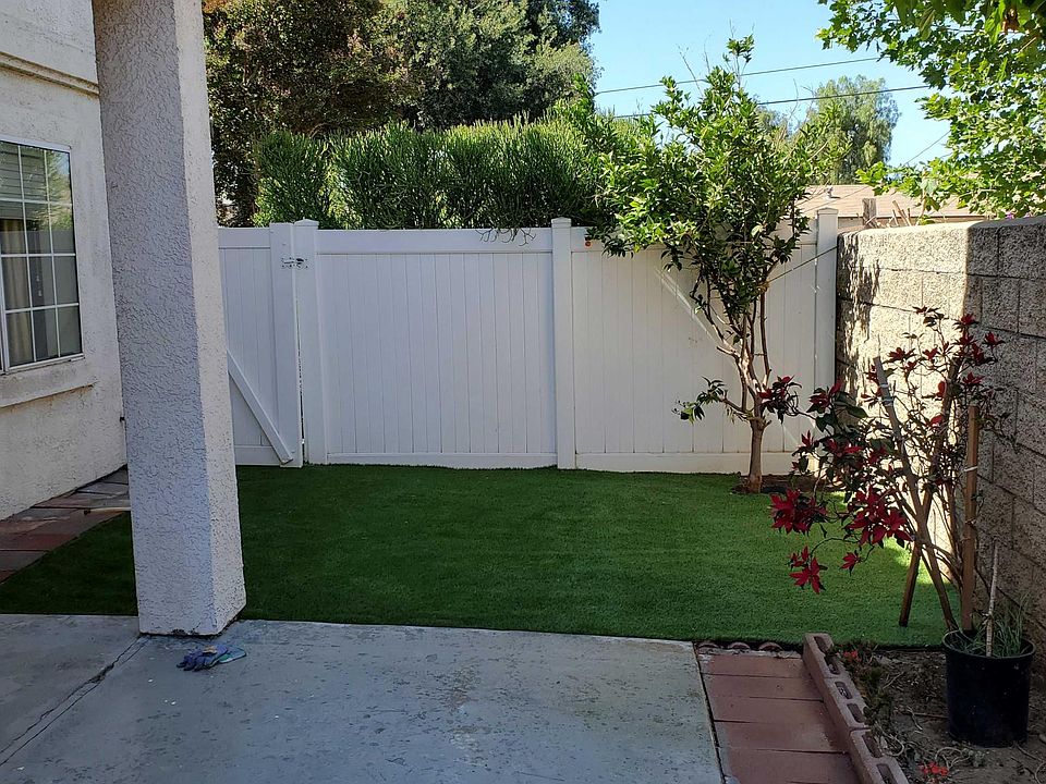 Spacious open sky backyard with grass