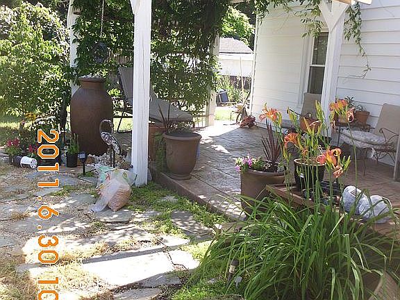 side patio and arbor as you enter