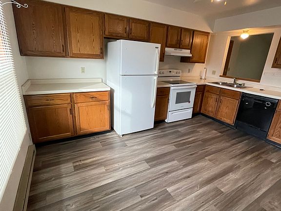 kitchen is bright and roomy for table and chairs