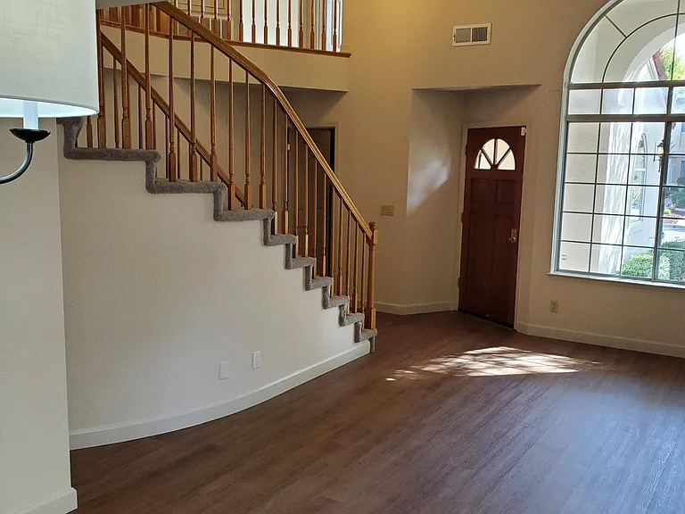 View from dining room to stairs to second floor.