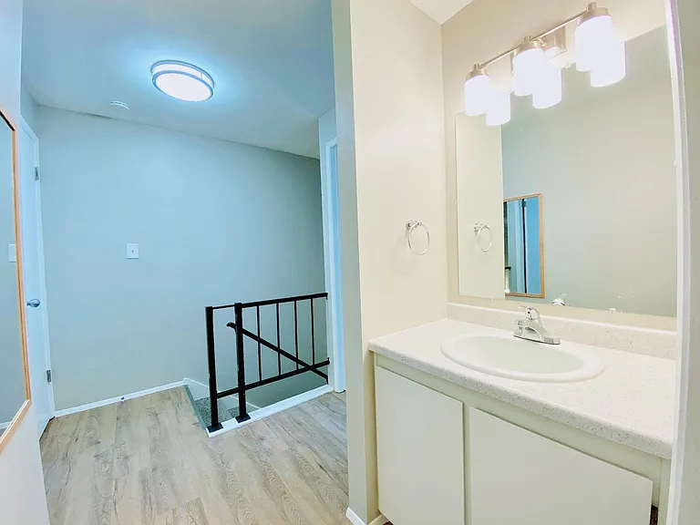 Bathroom - separated sink/vanity from shower/toilet.