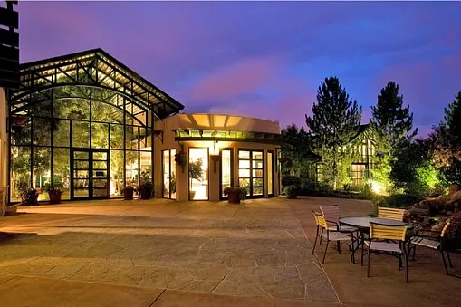 Main clubhouse with cafe, gym, indoor basketball court. Outside are tennis and pickleball courts