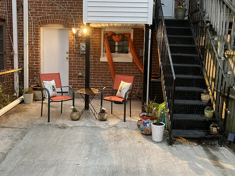 Outdoor space for entertaining and container gardening. Space for parking vehicle.