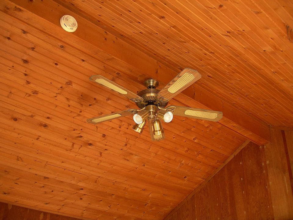 Porch has great ceiling with a fan.