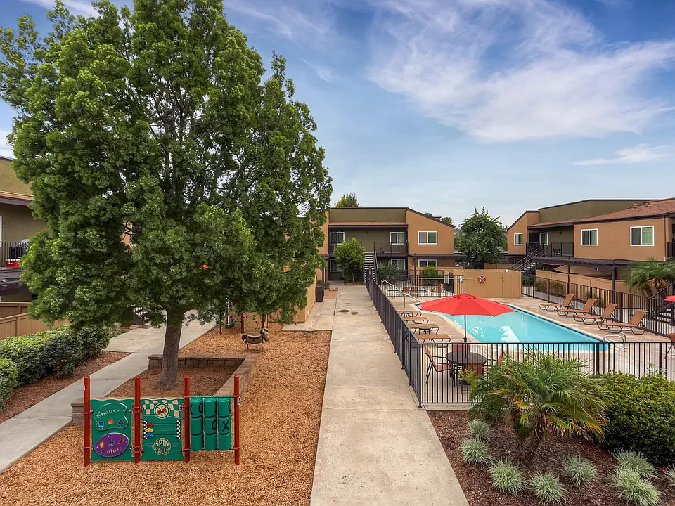 The Community Courtyard, Pool, and Playground at Midway Gardens Apartments