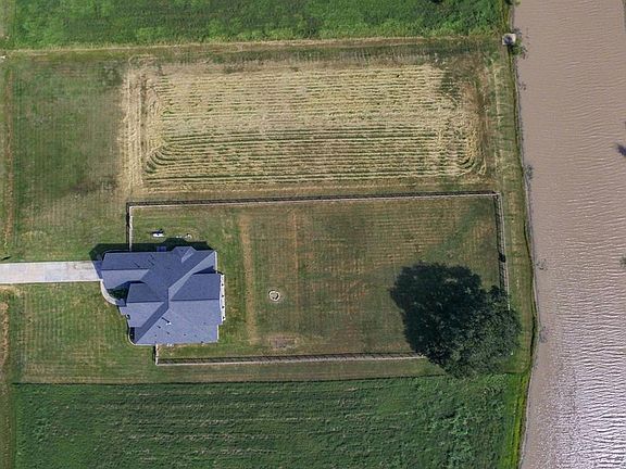The lot next to this home is available and could be negotiated with an offer on this home. This would give you two full waterfront acres.