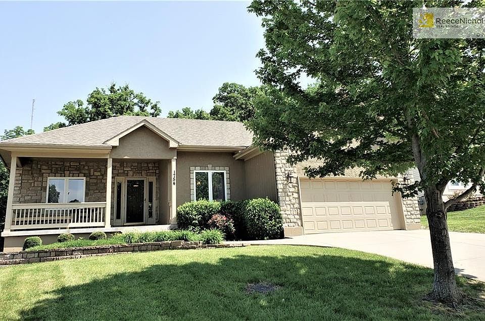 A rare find! 5 bedroom ranch, front porch with stone accents and move in ready!