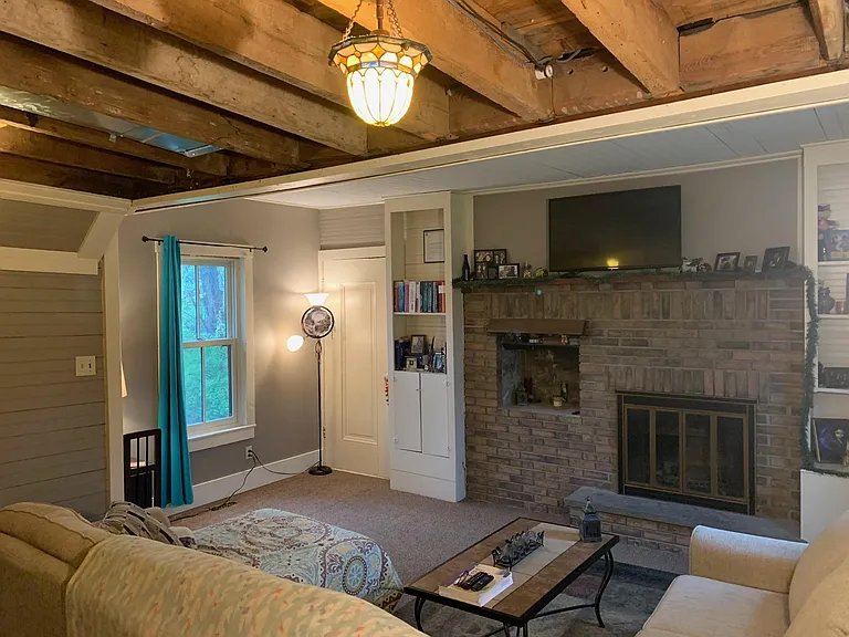 Livingroom shown with previous tenants furniture