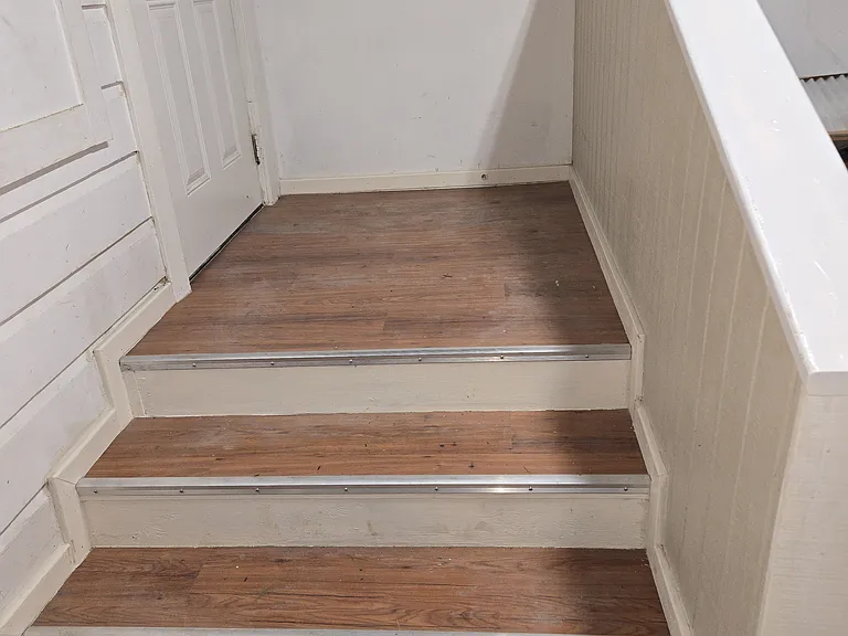 Stairs leading from Living Room to Laundry Room
