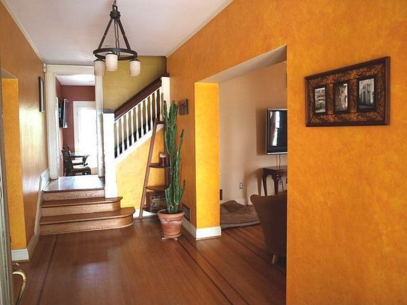 Formal Entry with original In-laid Hardwood Floors