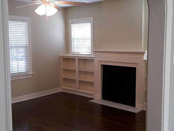 Living Room With Faux Fireplace And Built-Ins