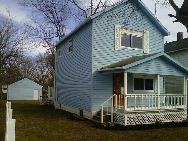 Side view of Home and Detached Storage/Garage