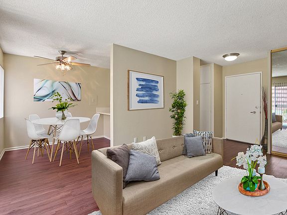 Living room and dining area with wood-style floors throughout