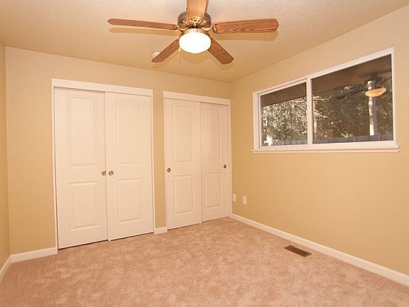 Den or 4th bedroom with ceiling fan
