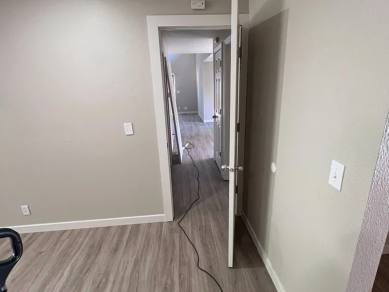 Master Bedroom looking down hallway into living room