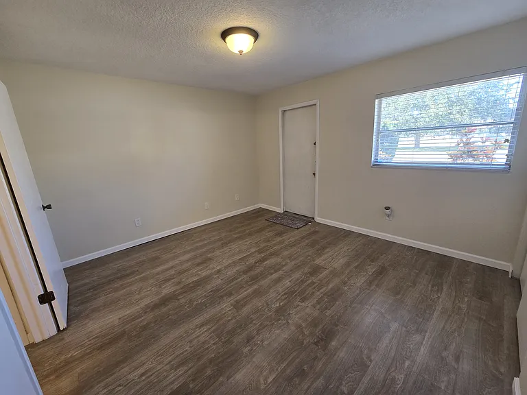 bedroom with door to back patio