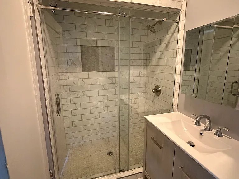bathroom shower and vanity