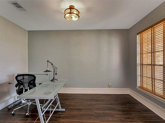 The study is located just off the entryway and has a large window that provides lots of natural light.