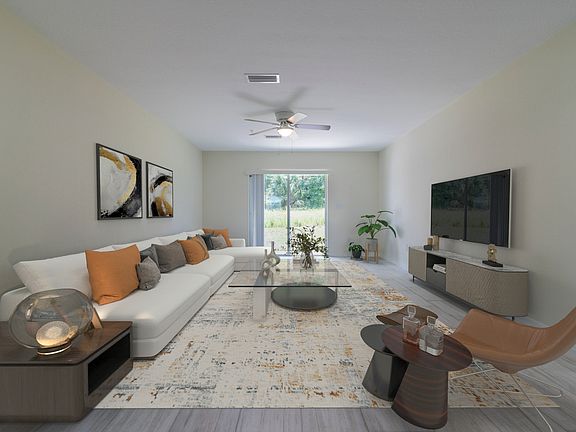 Spacious living/dining area with plenty of natural light. (Staged picture).