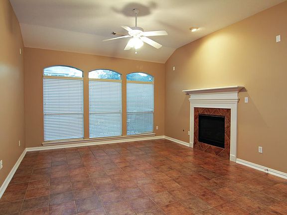 Living Room - This room features high ceilings, a picturesque gas log fireplace and much more!