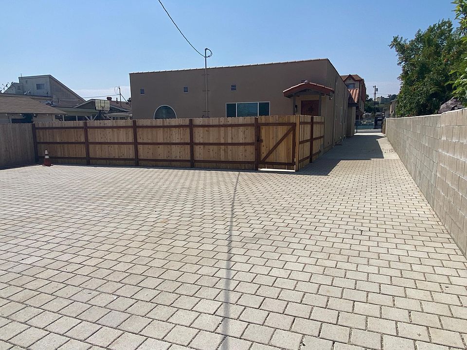 Exterior Fence view from Large Parking Lot w/2 tandem spots in front of the unit. Additional parking availabe