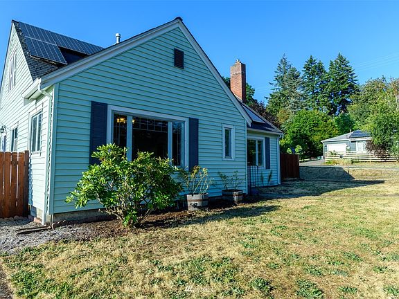 Classic home with solar panels, shutters, hot tub, fully fenced yard and so much more.>