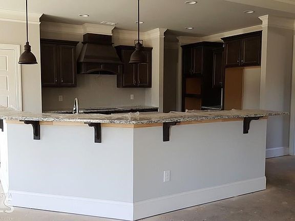 Beautiful kitchen with stainless Kitchen Aid Appliance Package. Gas Cooktop, Wall Oven, Microwave, V