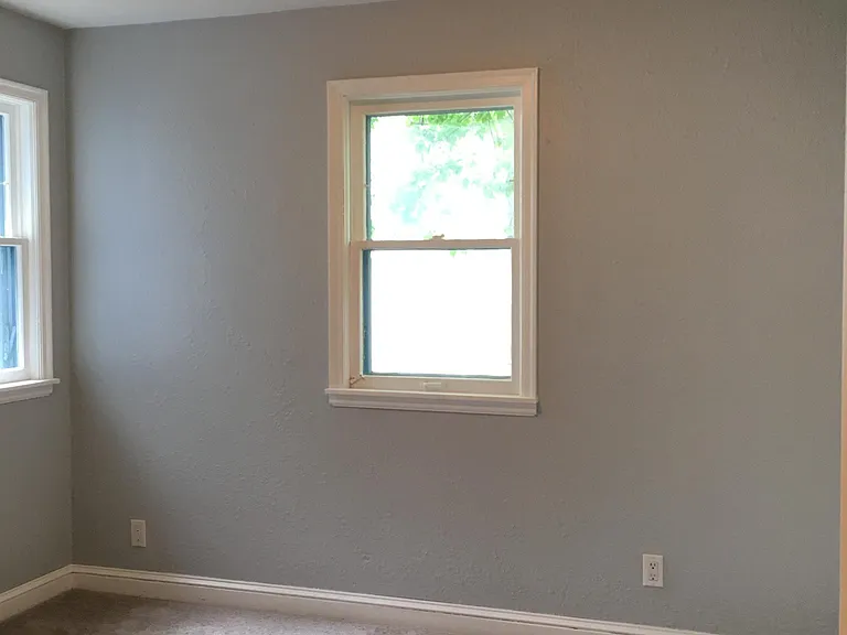 Main level bedroom, off of kitchen.