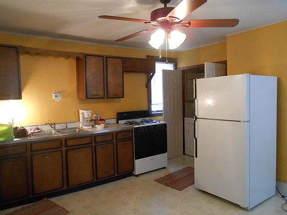 Kitchen with laundry in corner