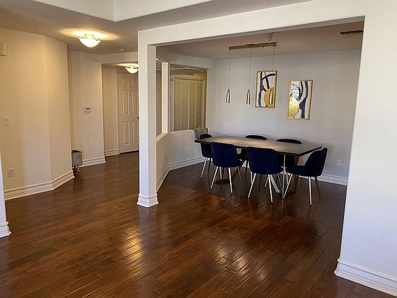 Dinning room. To the left is the entry way with a double door