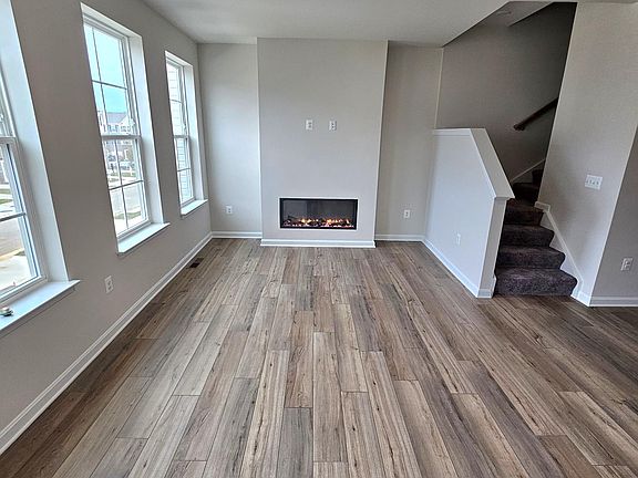 Great Room with electric fireplace radiating heat and color selections