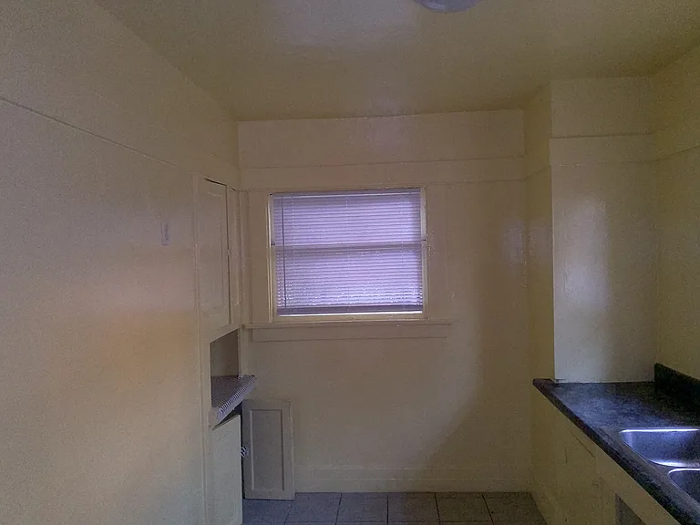 4318 Menlo - large kitchen lots of cabinets - ceramic tile floor for easy care - West view