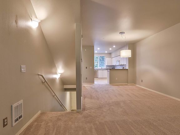 New carpet, paint, dishwasher and dining chandelier.