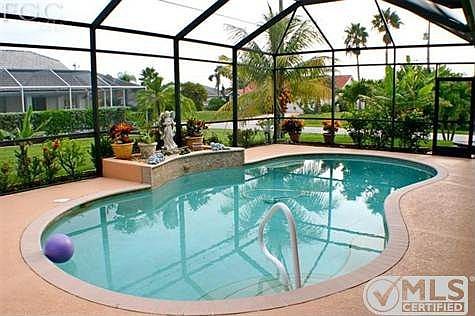 Pool has water feature, and is equipped with heater & self-cleaning system.