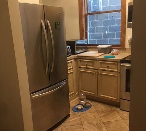 kitchen with large frig and freezer