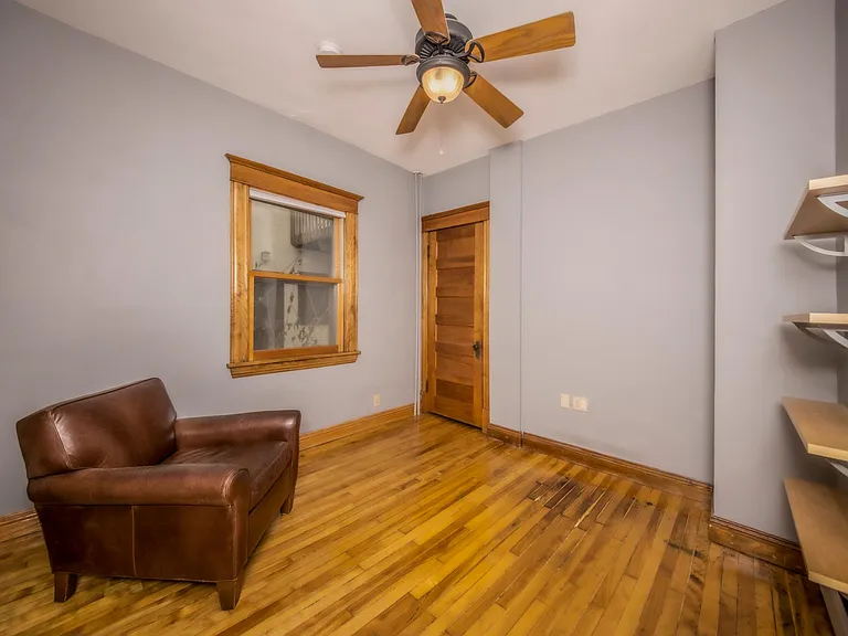 Main floor bedroom with built-in shelving - perfect for home office!