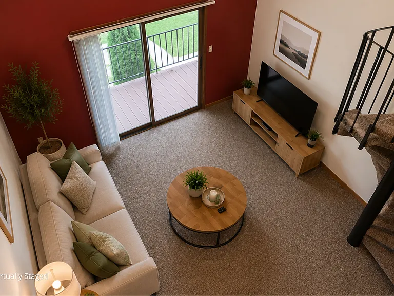 Soaring ceilings, abundant natural light, and a loft-inspired layout make this living space feel open, inviting, and effortlessly comfortable.